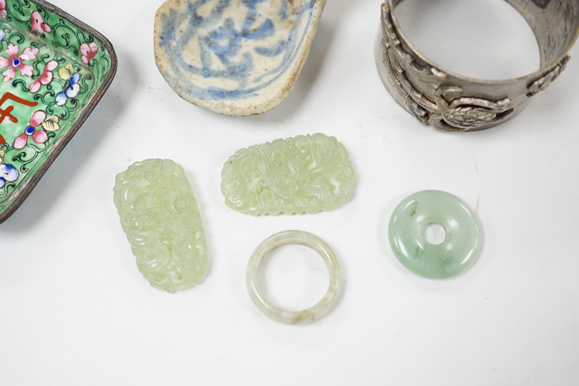 Four Chinese jade items, a pottery spoon, napkin ring and enamel dish, dish 6.5cm wide